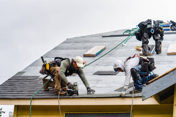 Professional Gutter Installation technician working in Russell, KS